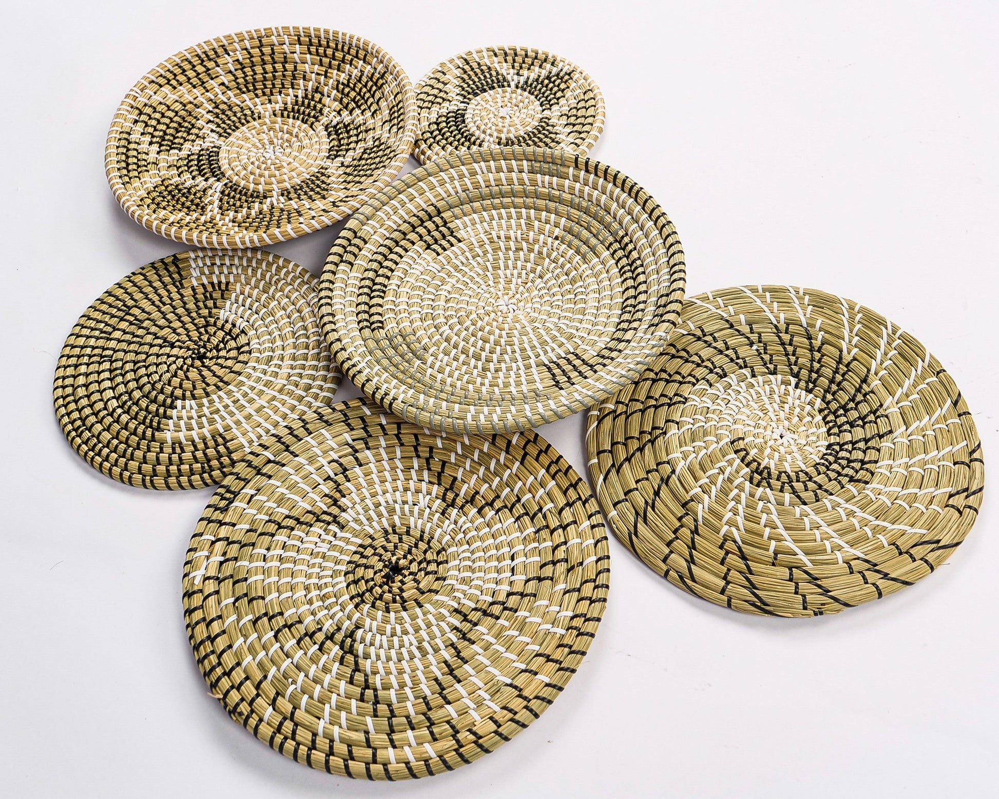 Neutral Harmony basket collection showcasing intricately woven boho-style designs, perfect for adding natural elegance to your home decor.