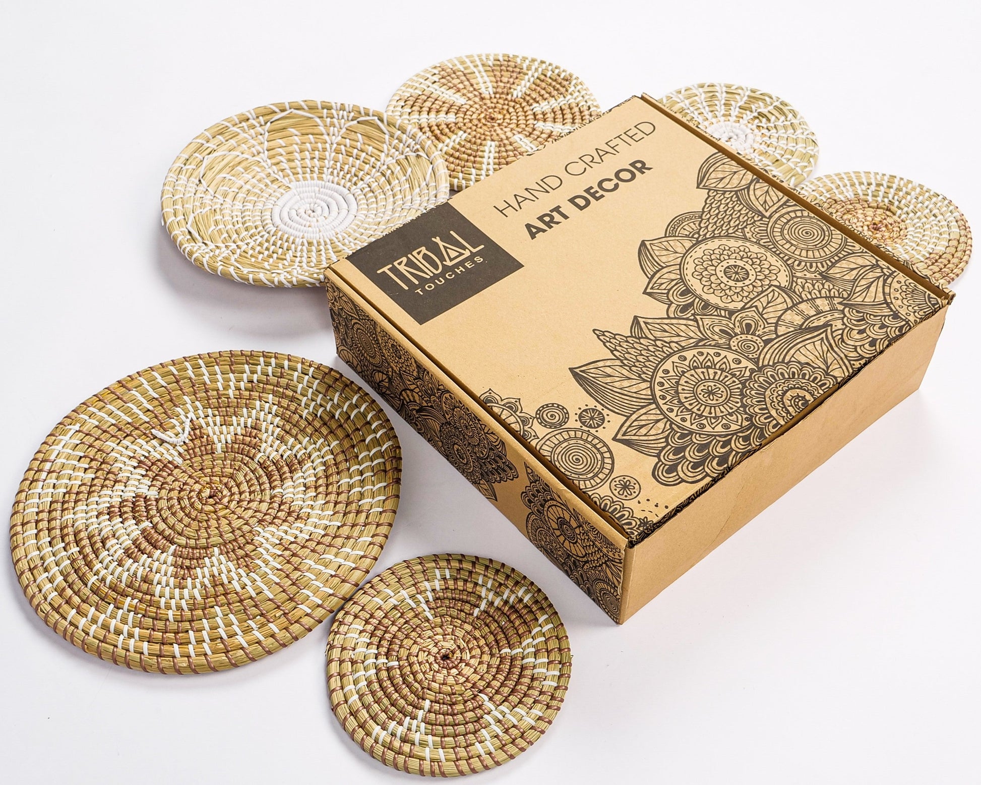 Handcrafted seagrass wall décor set in Tribal Touches packaging.
