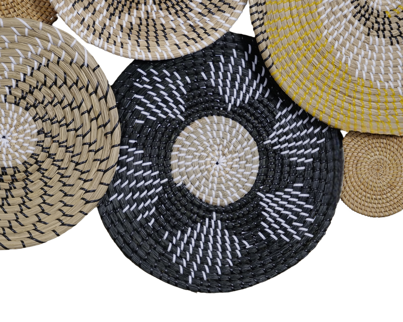Close-up of Sunburst Fusion wall decor showcasing intricate black, natural, and yellow woven patterns.